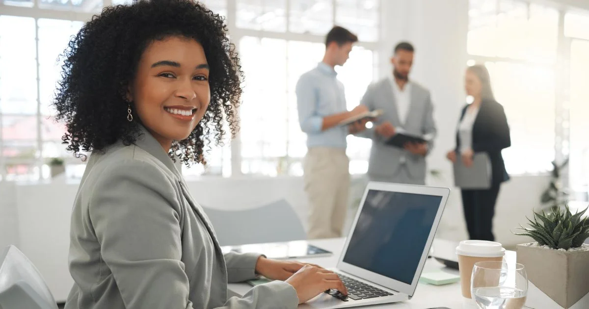 Professional woman working on laptop in office